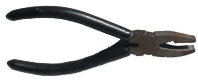 Breaker-grozier pliers (breaking and grozing) — the flat breaker jaw parts the glass along a score, while the serrated grozier jaw nips and shapes the edges; distinct from running pliers, which you use to run a long scored line